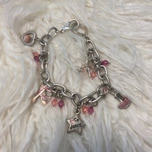 Silver hued dance charm bracelet